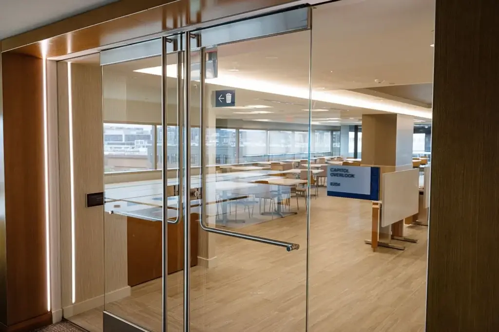 All glass office entrance doors and glass partition walls along a corridor