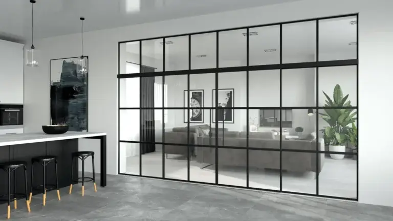 Black grid glass wall between a kitchen and living room