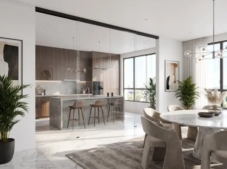 Frameless glass wall on a black top track separating a kitchen from a dining area