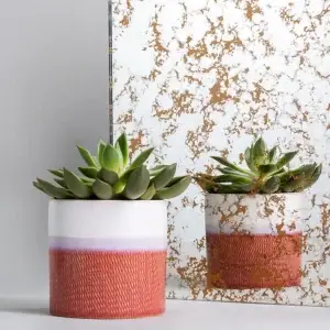 Cometa antique mirror sample with scattered gold-toned flecks