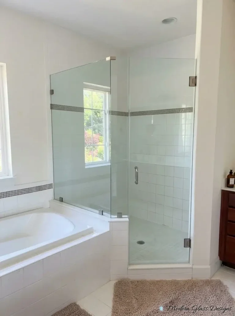 Frameless corner shower enclosure next to a soaking tub