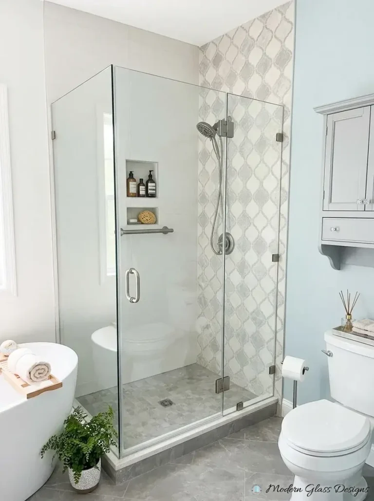 Frameless 90 degree corner shower with brushed nickel handle and hinges