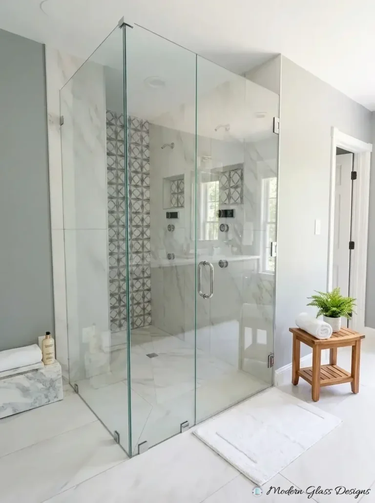 Frameless corner shower enclosure with brushed nickel hinges
