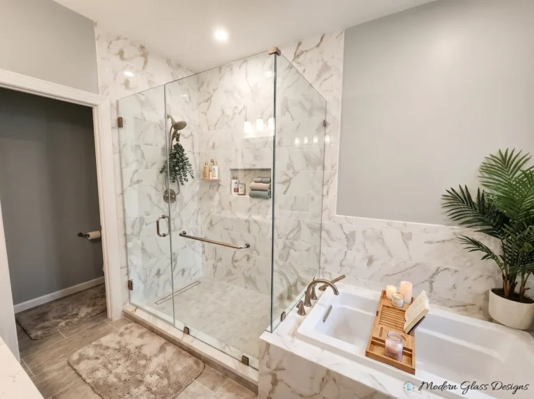 Frameless corner shower with a glass door, panel and return beside a drop-in tub