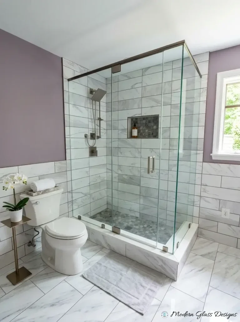 Frameless corner shower enclosure with brushed nickel header bar