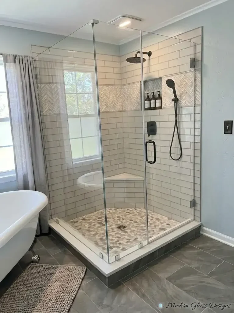 Frameless corner shower enclosure with a corner bench