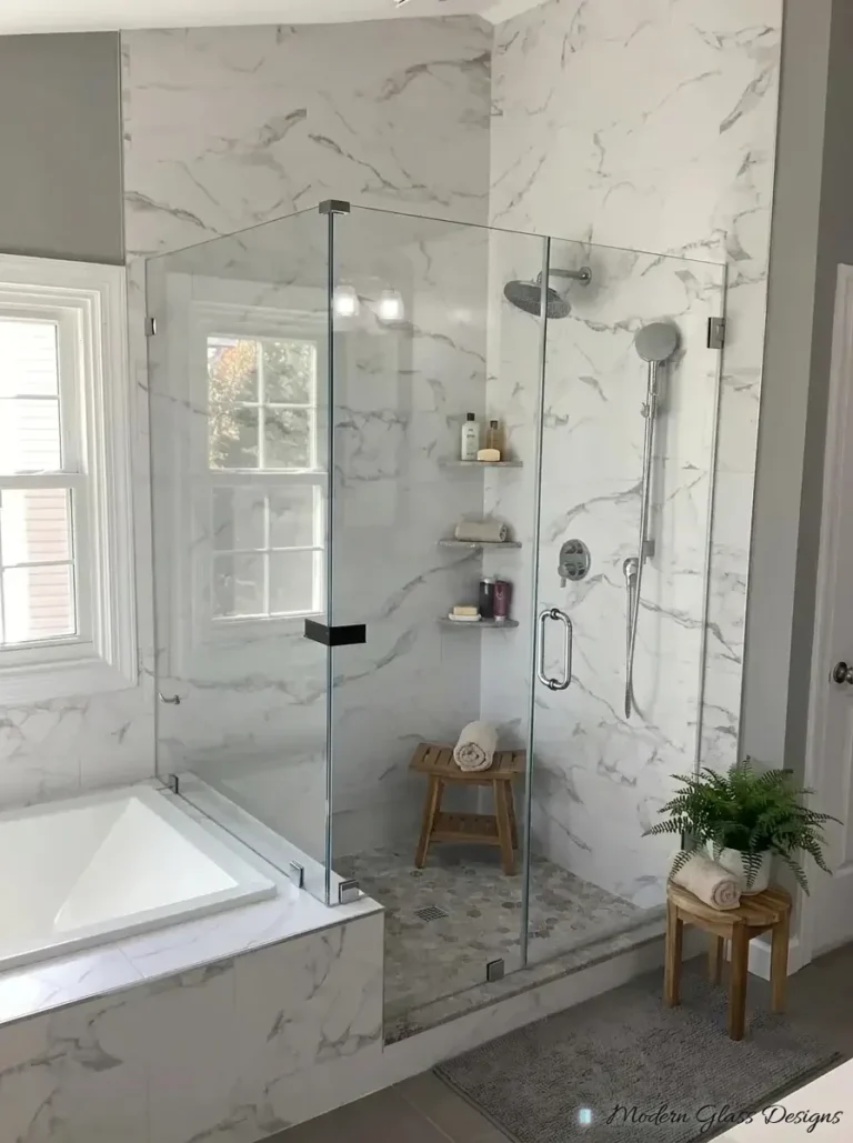 Frameless corner shower beside a tub with a glass support clamp