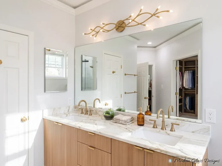 Frameless vanity mirror with a beveled side mirror above a wood vanity