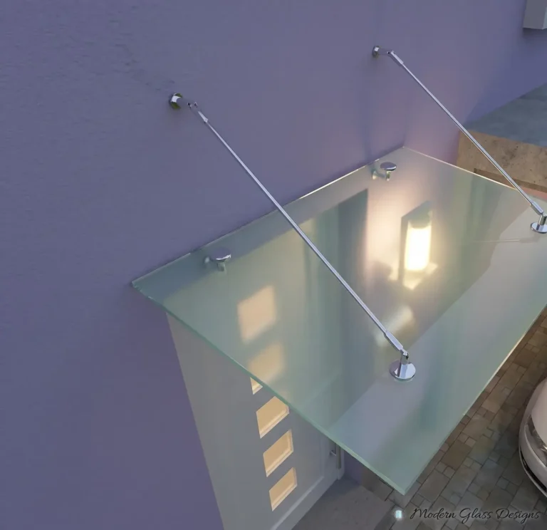 Frosted glass canopy on two steel support rods above an entry door