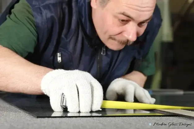 Glass being cut to size for a custom project