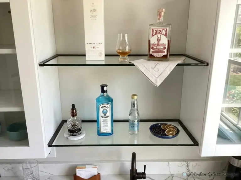 Glass shelves holding bottles in a bar niche