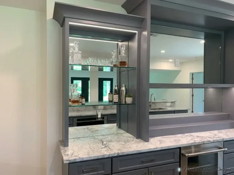 Glass shelves on a mirrored back bar