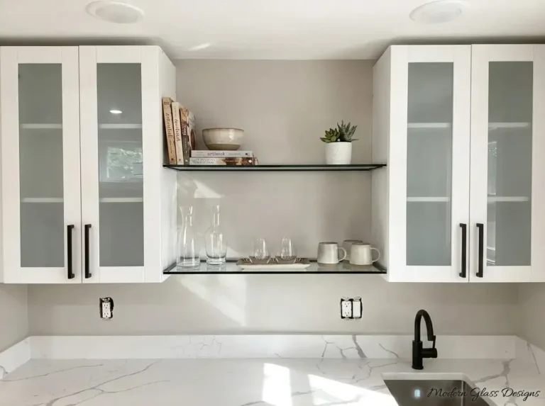 Floating glass shelves between white kitchen cabinets
