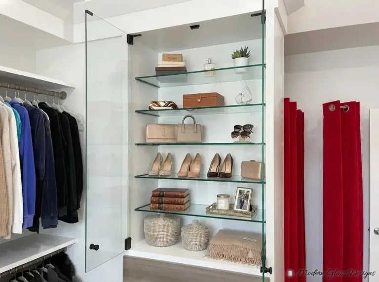Glass shelves displaying shoes and bags in a closet
