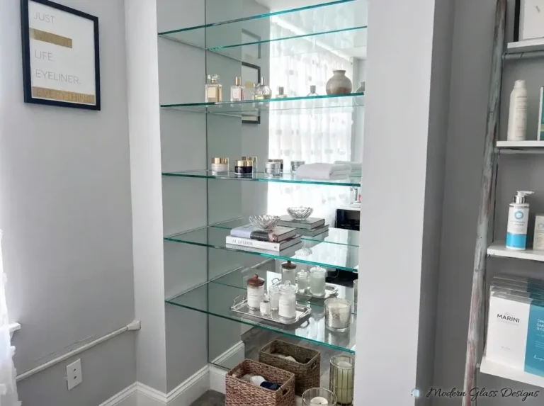 Glass display shelves in a mirrored alcove