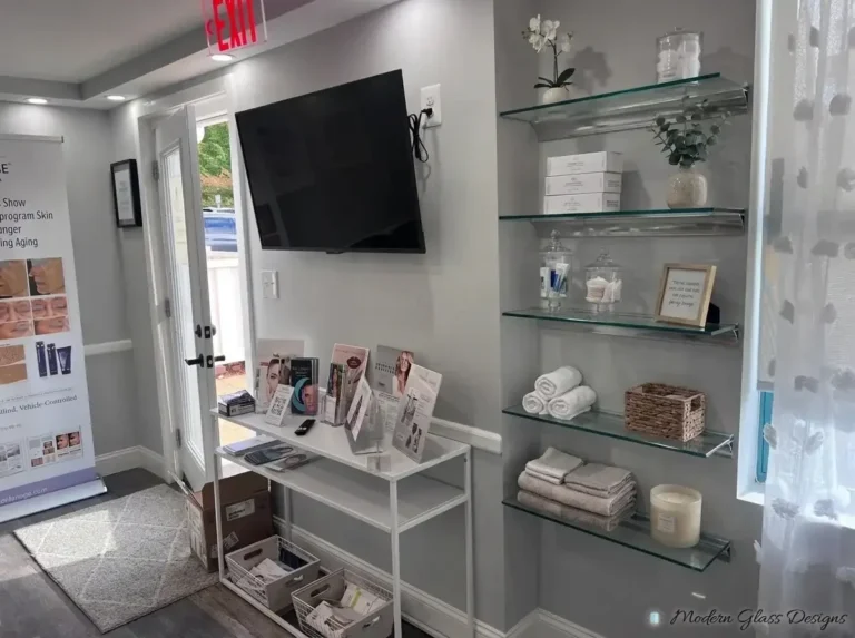 Wall-mounted glass display shelves in a salon