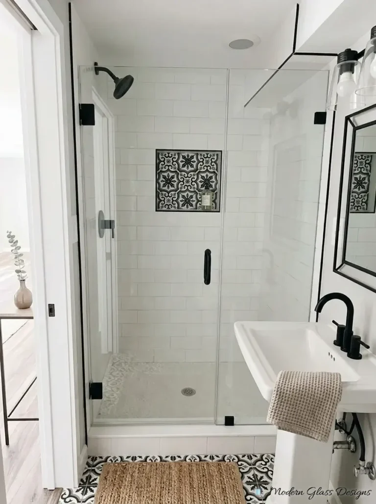 Frameless inline shower door and panel with matte black hinges and pull