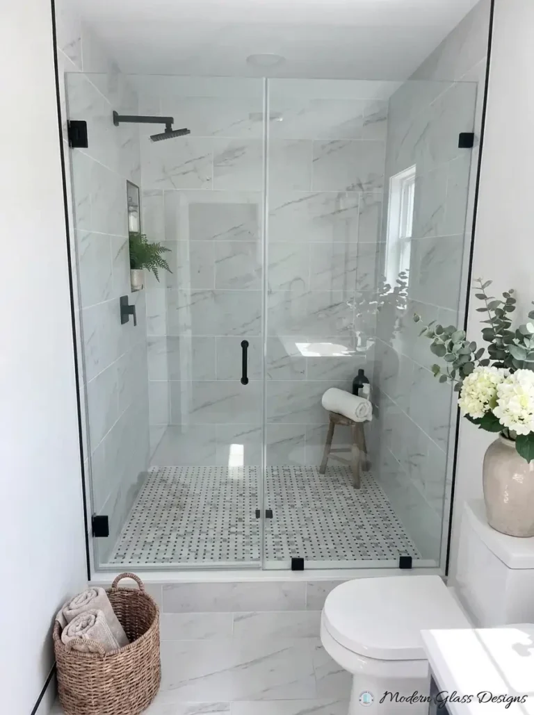 Frameless inline shower door and panel with matte black clamps
