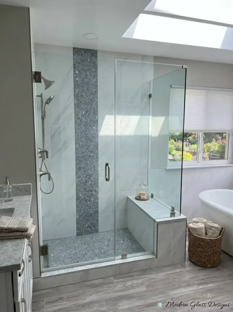 Frameless corner shower with door and glass return on a tiled bench