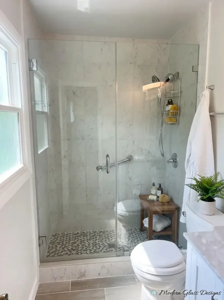 Frameless inline shower door with towel bar handle and chrome hinges