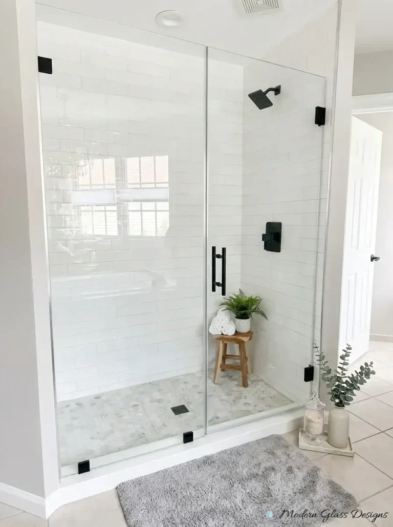 Large frameless inline shower panel and door with matte black clamps and pull