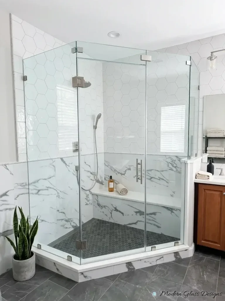 Frameless neo-angle shower enclosure with brushed nickel hinges