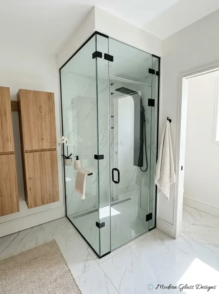 Corner steam shower enclosure with matte black channels to the ceiling