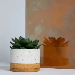 Tramonto antique mirror sample with a copper-toned finish